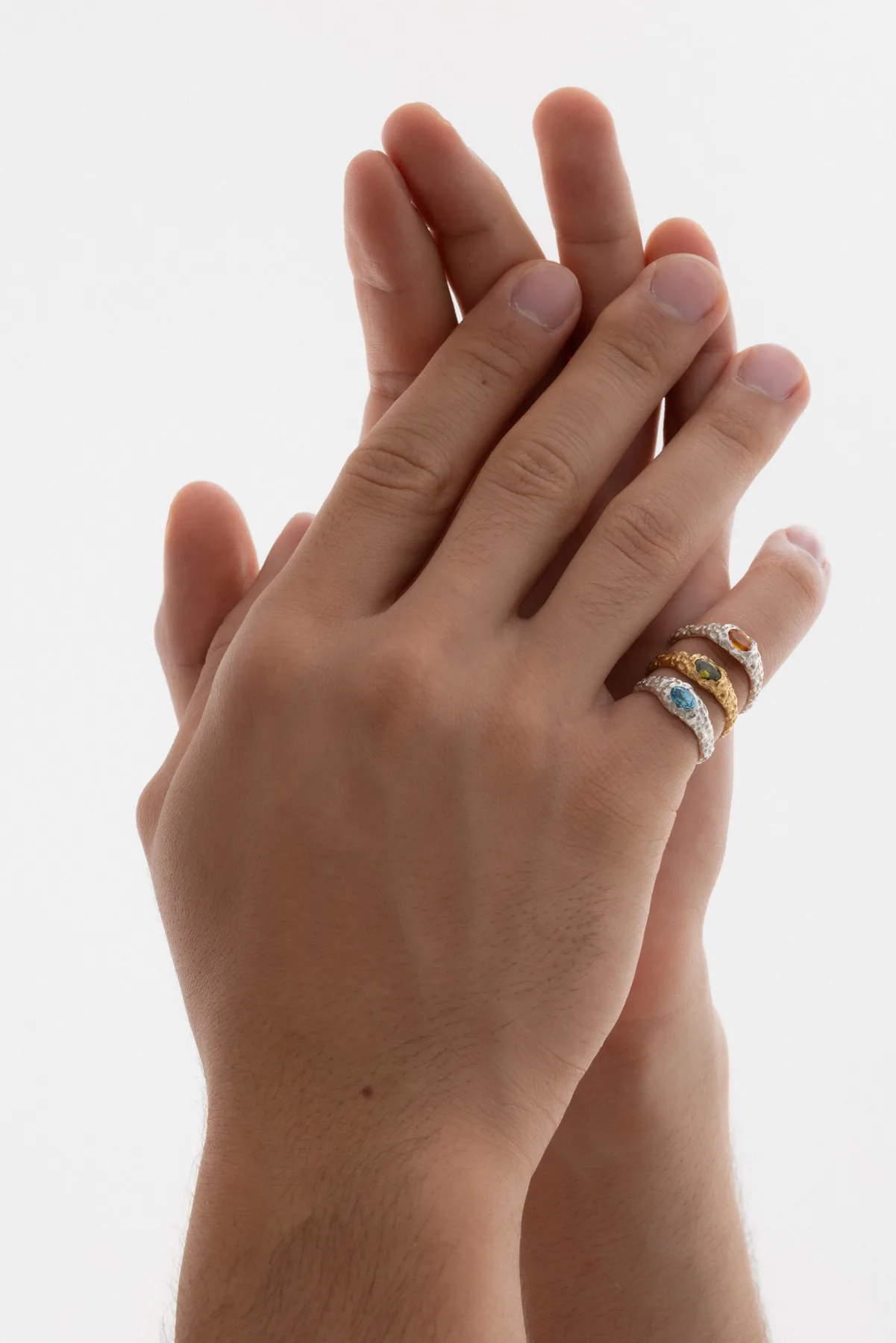 Hoyara rings, three Bingin rings with coloured stones on the fingers