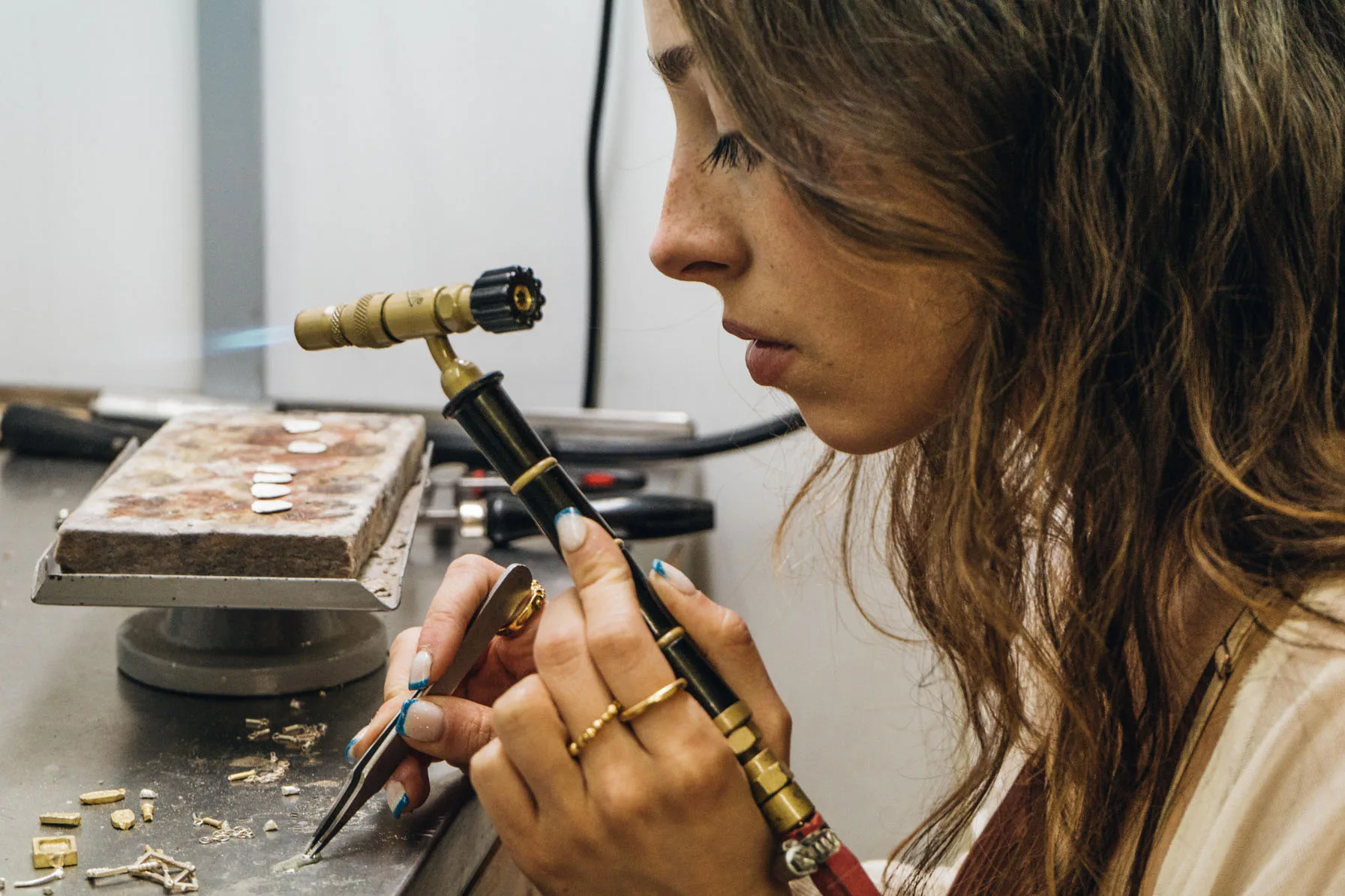 Sara at the atelier, making each piece by hand
